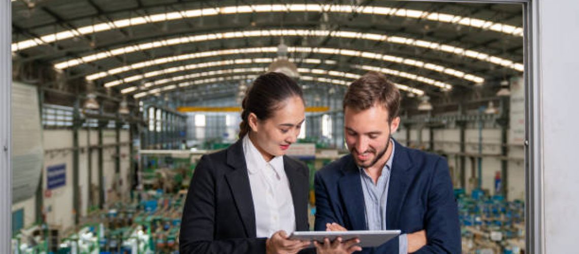 Factory Owner Talking With Operations Manager