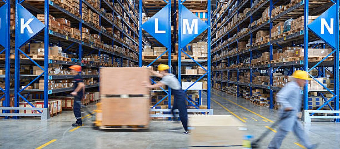 Cardboard boxes on shelves in warehouse. Storhouse.